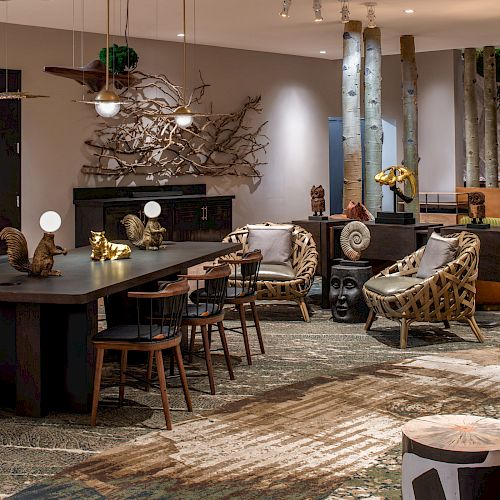 A modern lounge with eclectic furniture, artistic decor, warm lighting, and unique design elements, including wooden accents and sculptures.